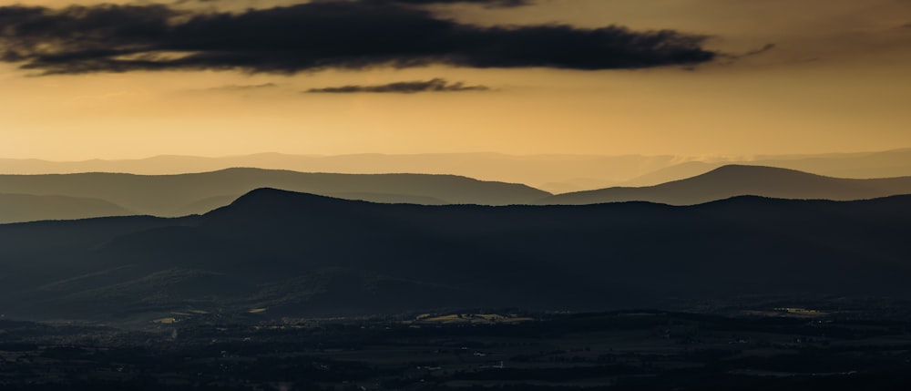 a view of a mountain range at sunset