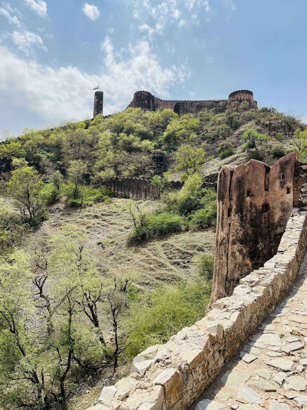 a stone wall on the side of a hill