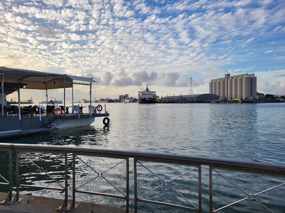 a boat is docked at a dock in the water