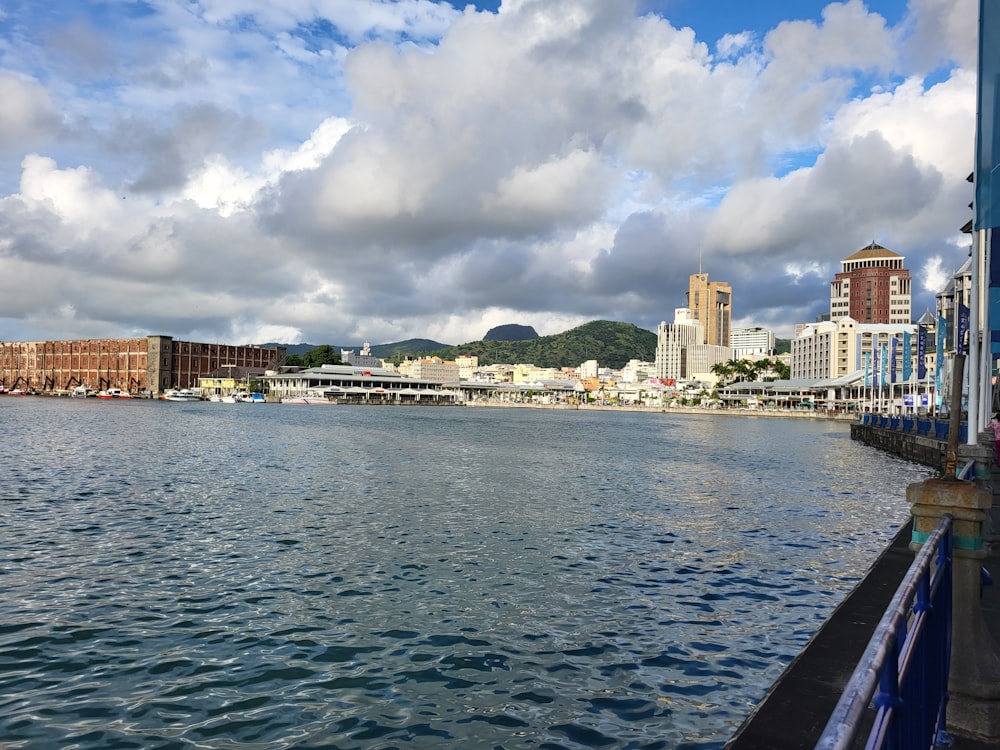 a body of water with buildings in the background