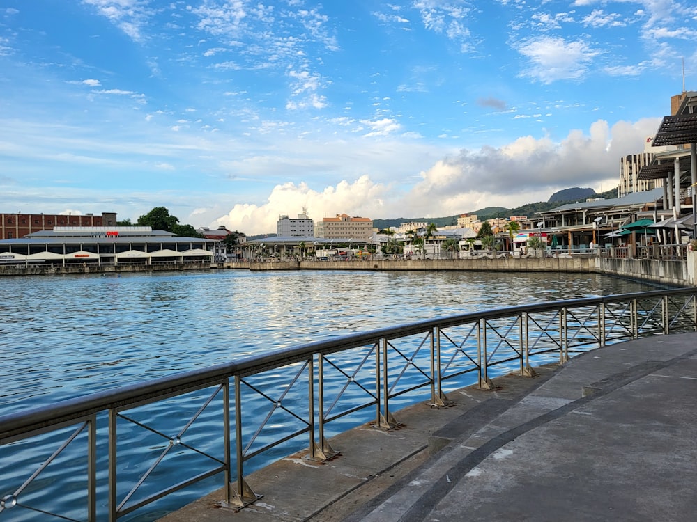 a body of water with buildings in the background