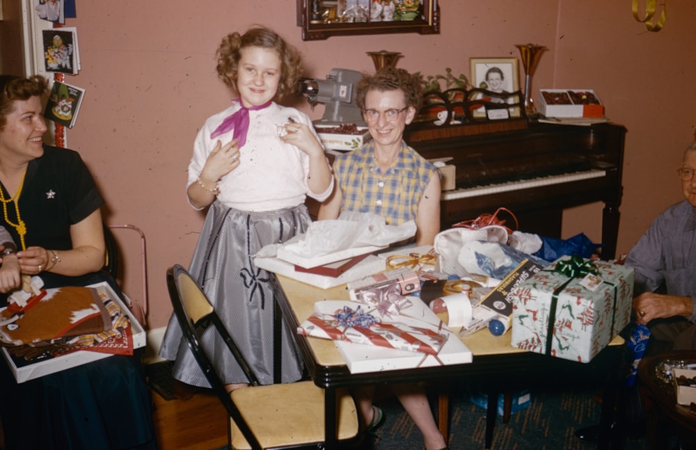 a group of people sitting around a table