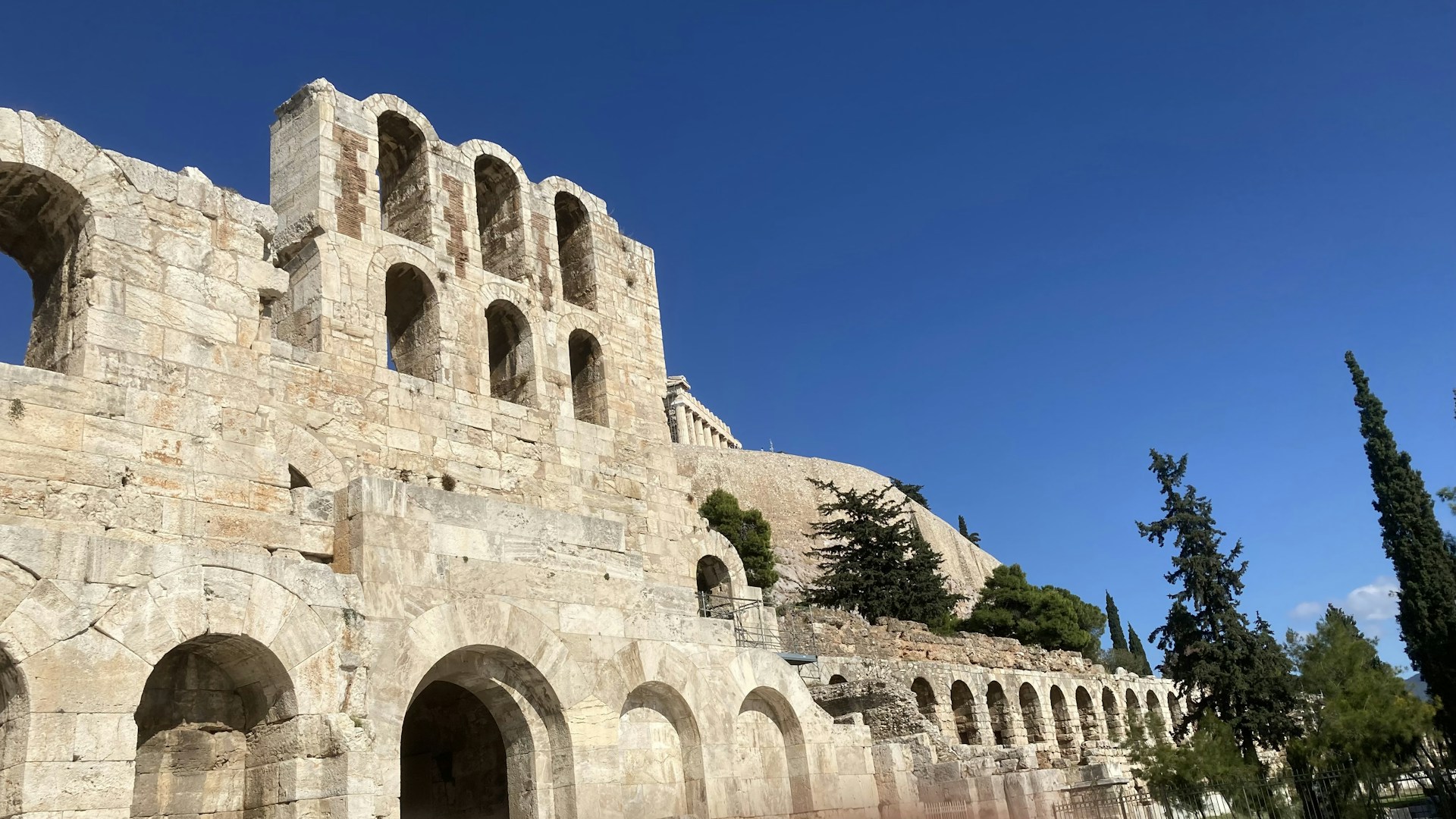 a large stone building with arches and windows