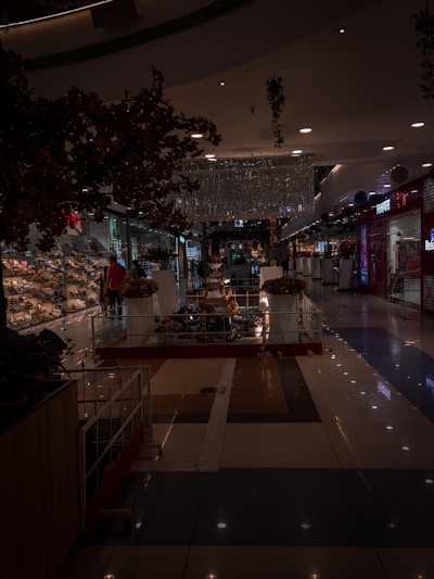 A softly lit photo of a quiet mall corridor under gentle renovation lighting.