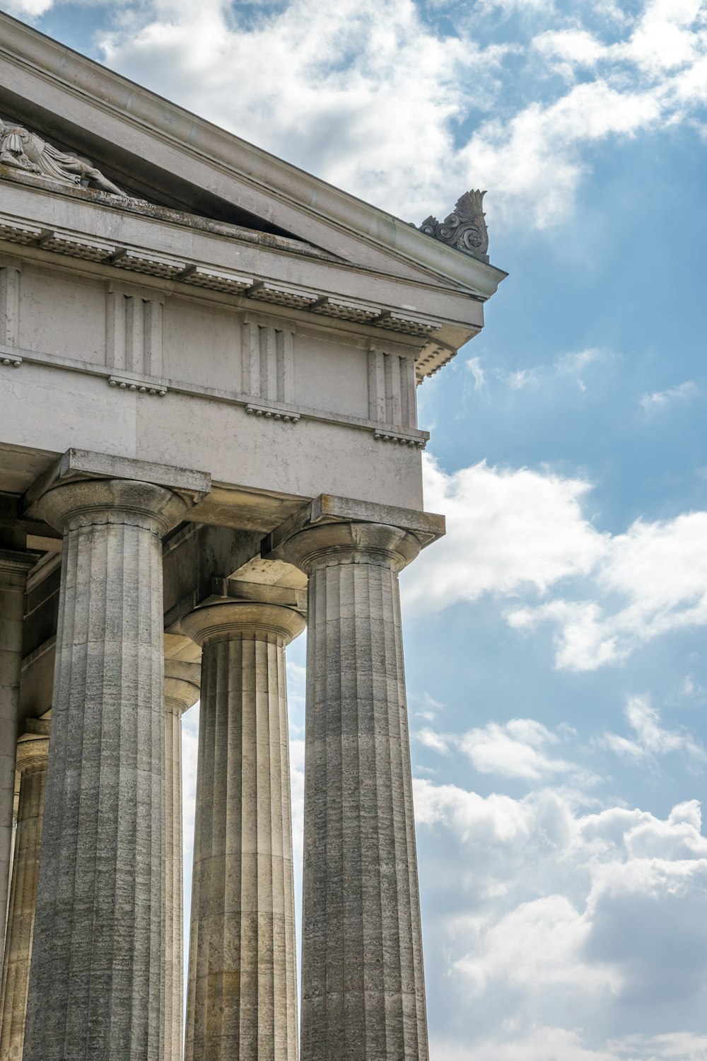 a very tall building with some very big pillars