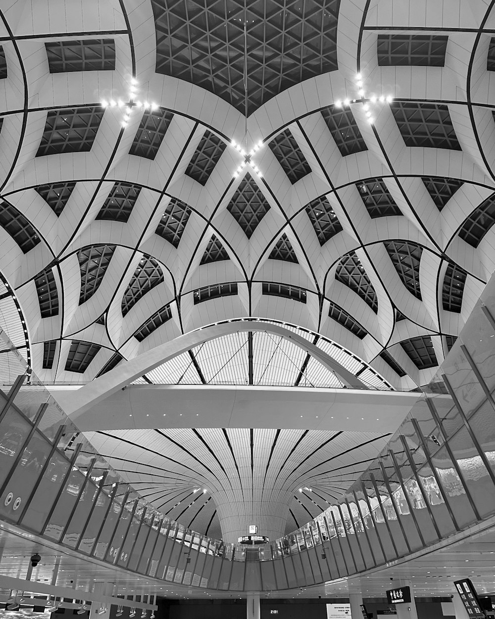 a black and white photo of a train station