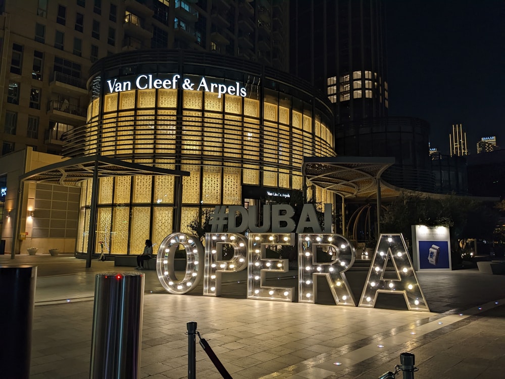 a sign that says urban opera in front of a building