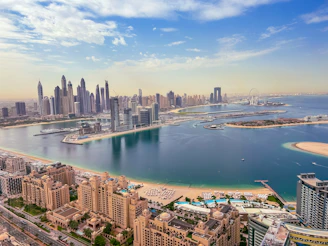 an aerial view of a city and a body of water