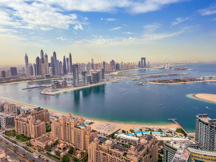 an aerial view of a city and a body of water