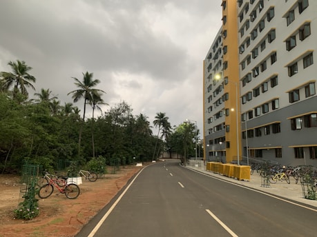 a street with a few bikes parked on the side of it