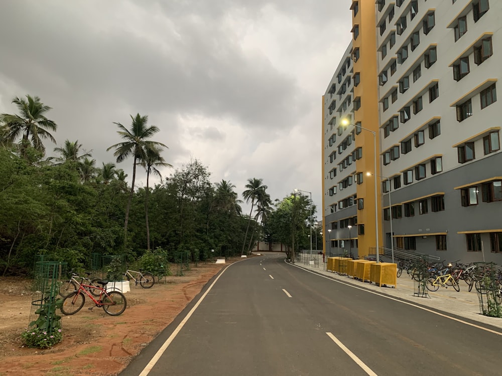 a street with a few bikes parked on the side of it