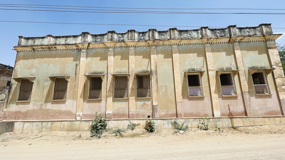 an old run down building with broken windows