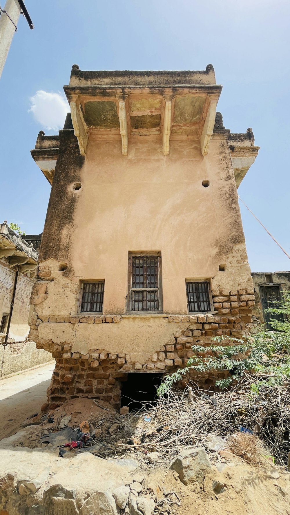 a very old building with a window on the side of it