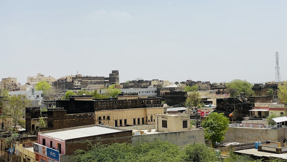 a city with lots of buildings and trees