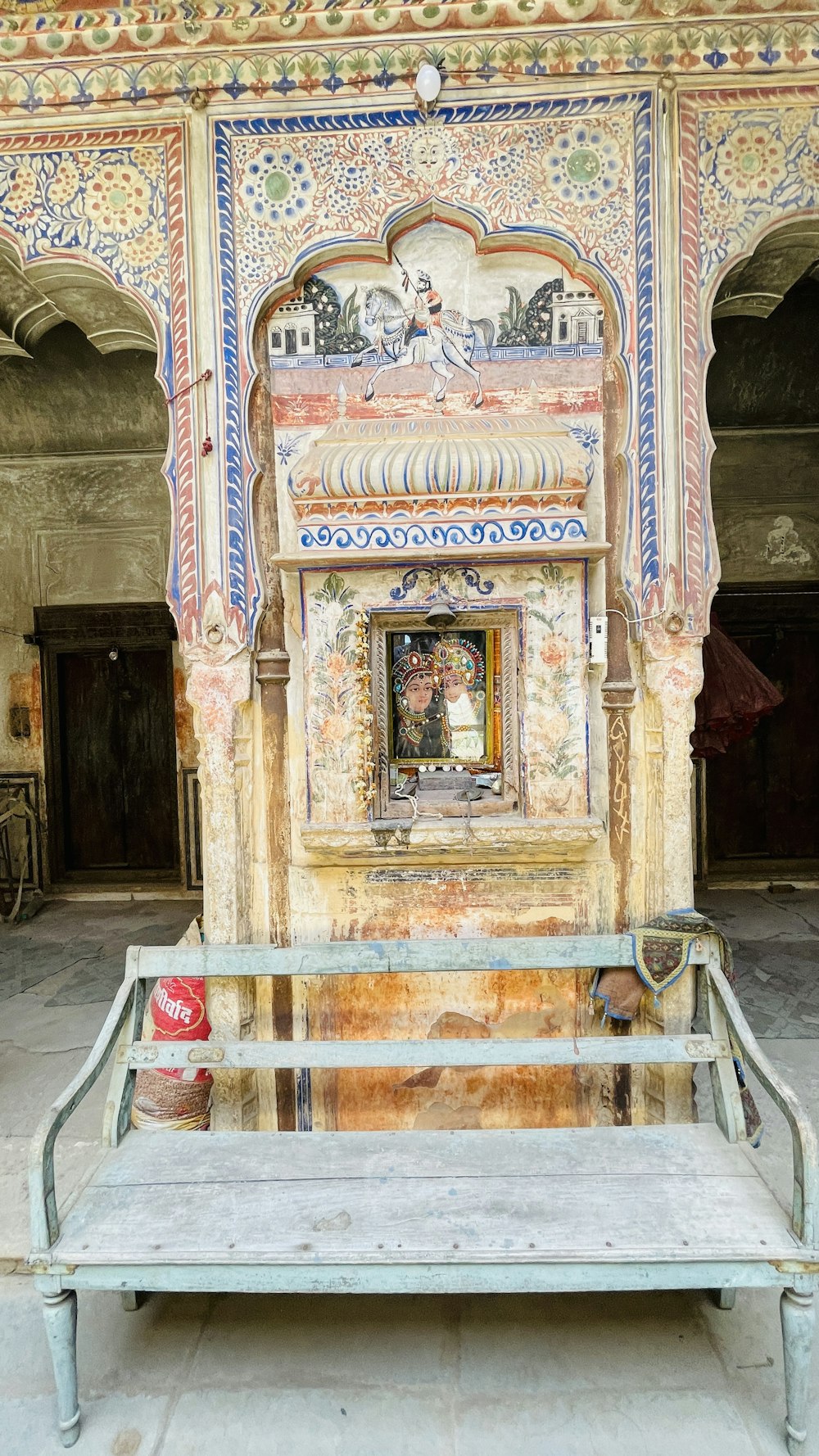 a bench with a painting on the back of it