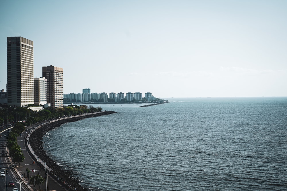 a large body of water with a city in the background