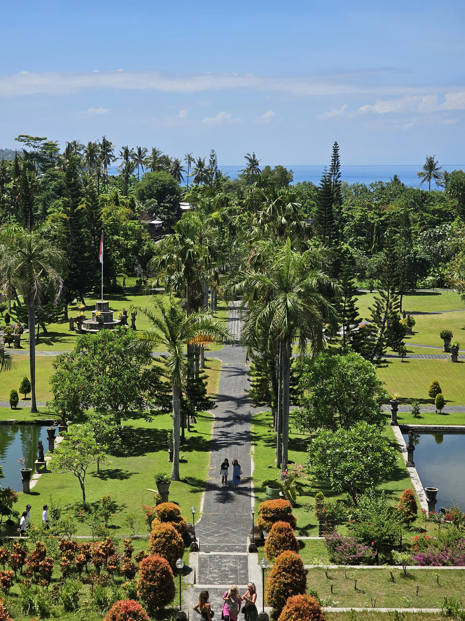 Taman Ujung royal water garden in East Bali with palm trees and ponds