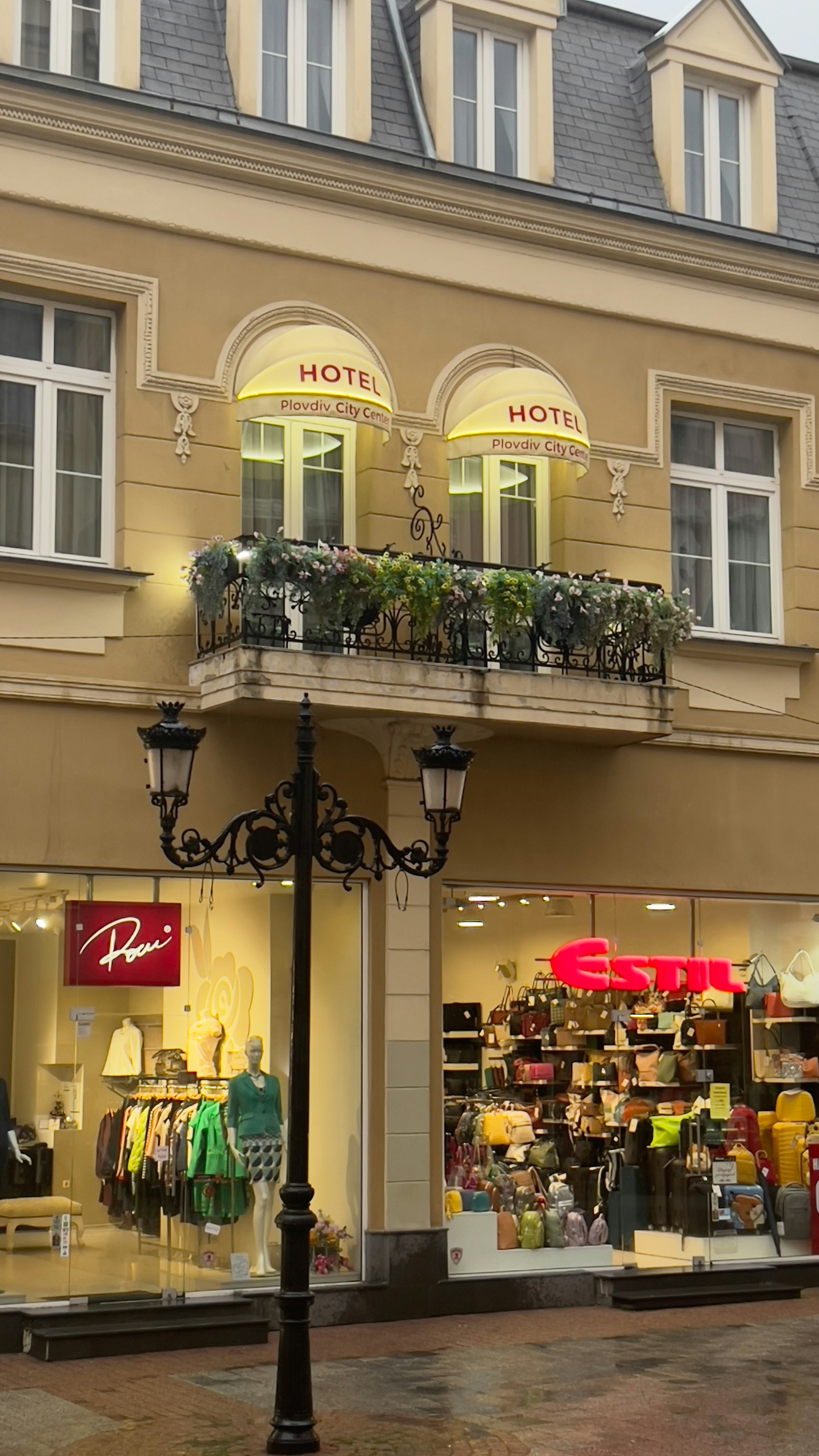 a street light in front of a hotel
