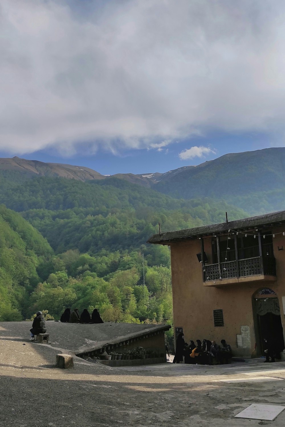 a building in the middle of a mountain range