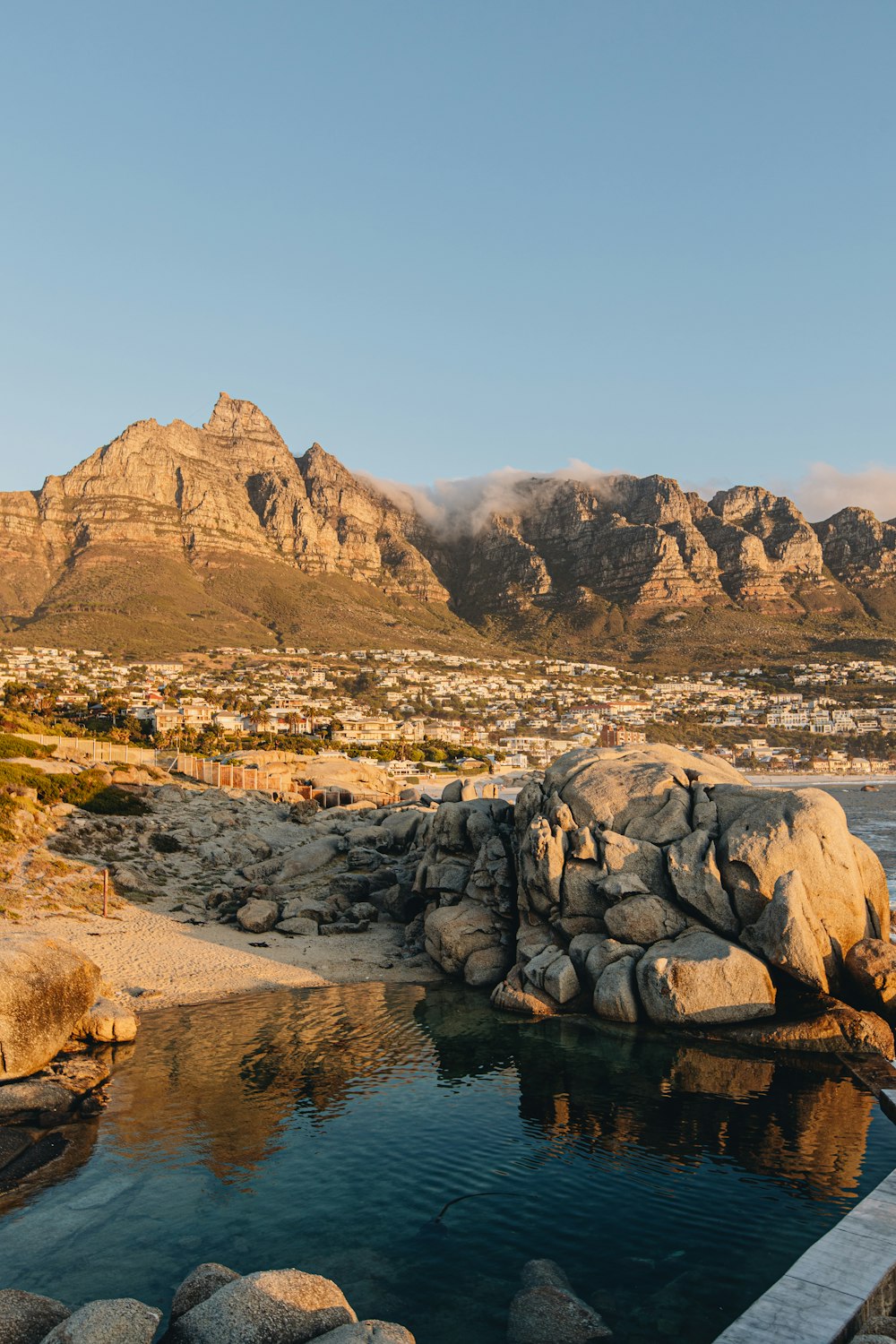 a body of water surrounded by rocks and mountains