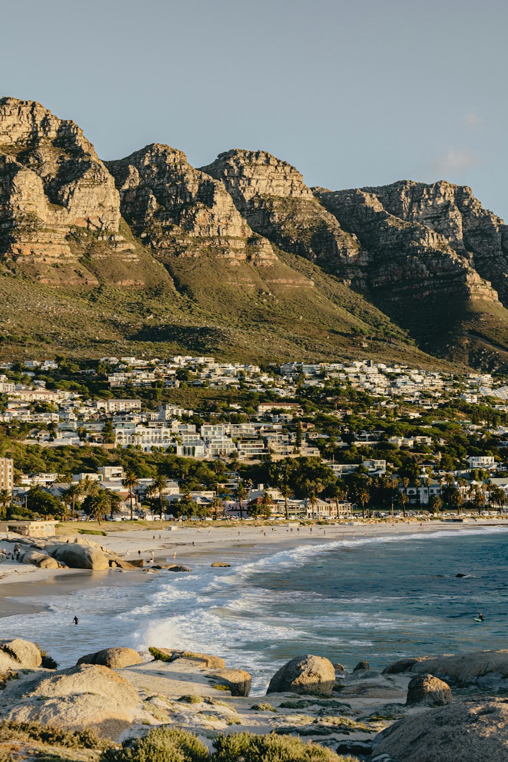 a view of a beach with mountains in the background