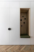 Custom fitted built-in wooden shelf seamlessly integrated in a home office