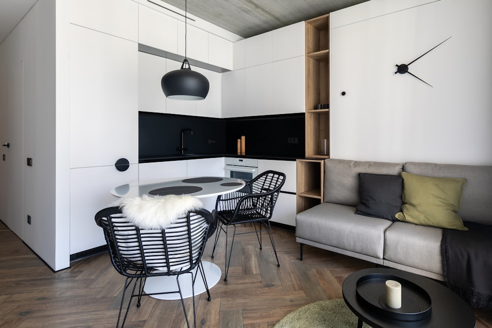 a living room with a couch a table and chairs