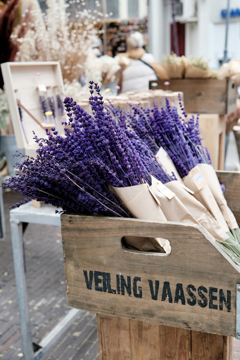 a wooden crate filled with lots of purple flowers
