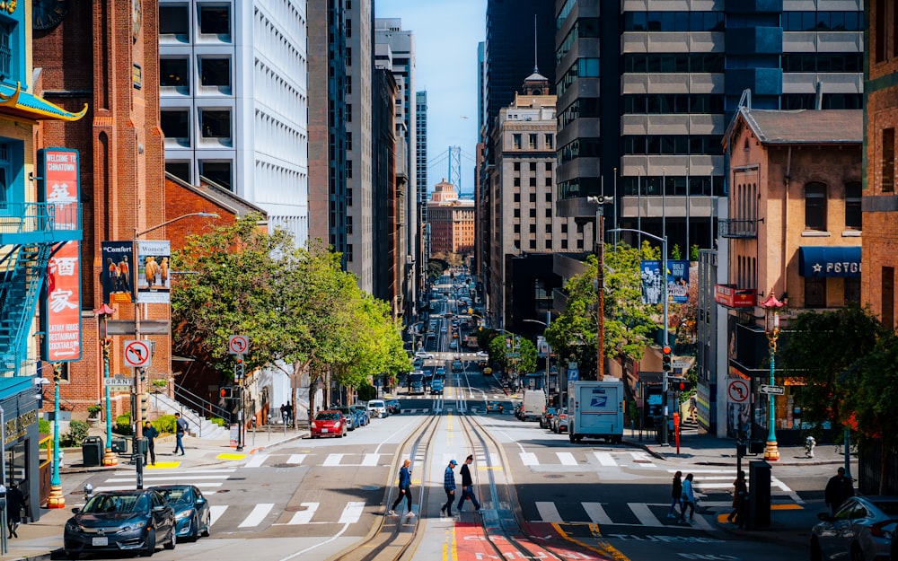 a city street filled with traffic and tall buildings