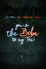 a neon sign that says you're the boba to my tea