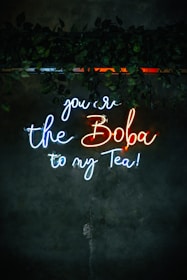 a neon sign that says you're the boba to my tea