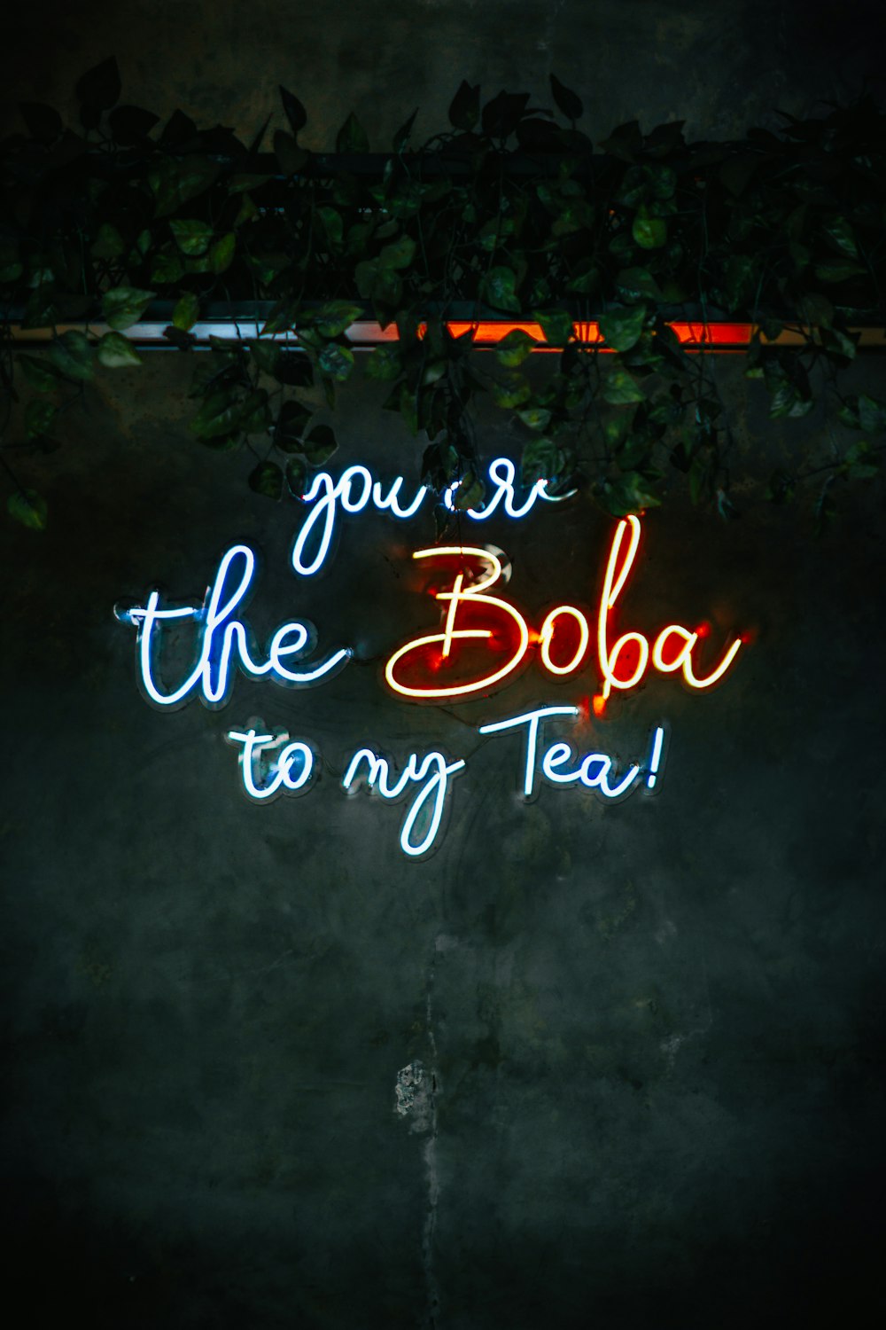a neon sign that says you're the boba to my tea