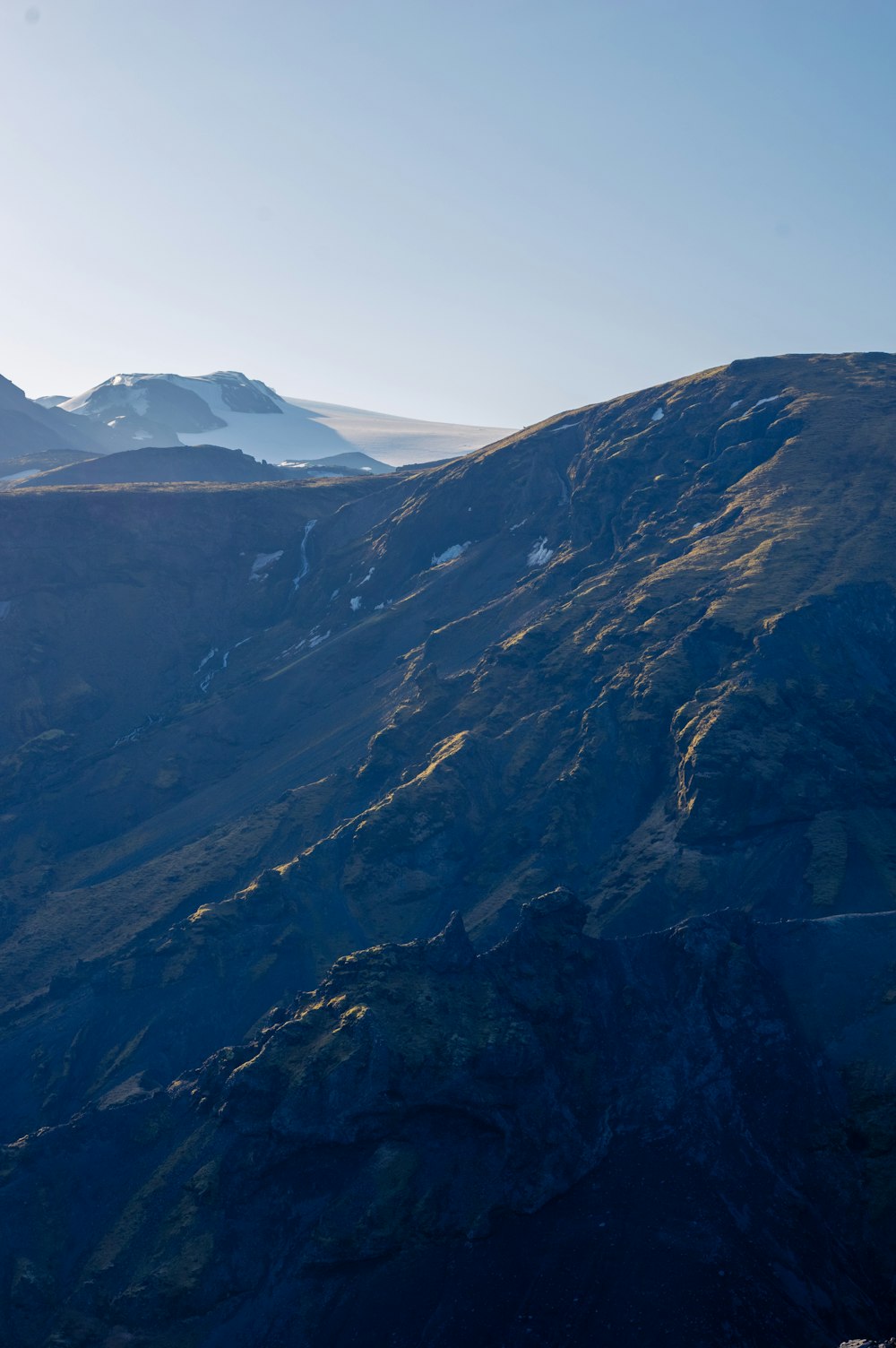 a view of a mountain with snow on the top