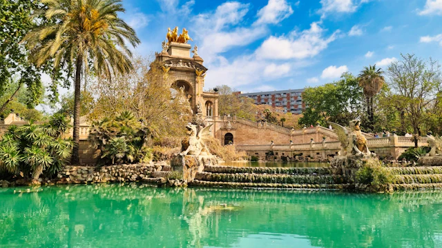The Cascada fountain and lake in Parc de la Ciutadella, blue sky