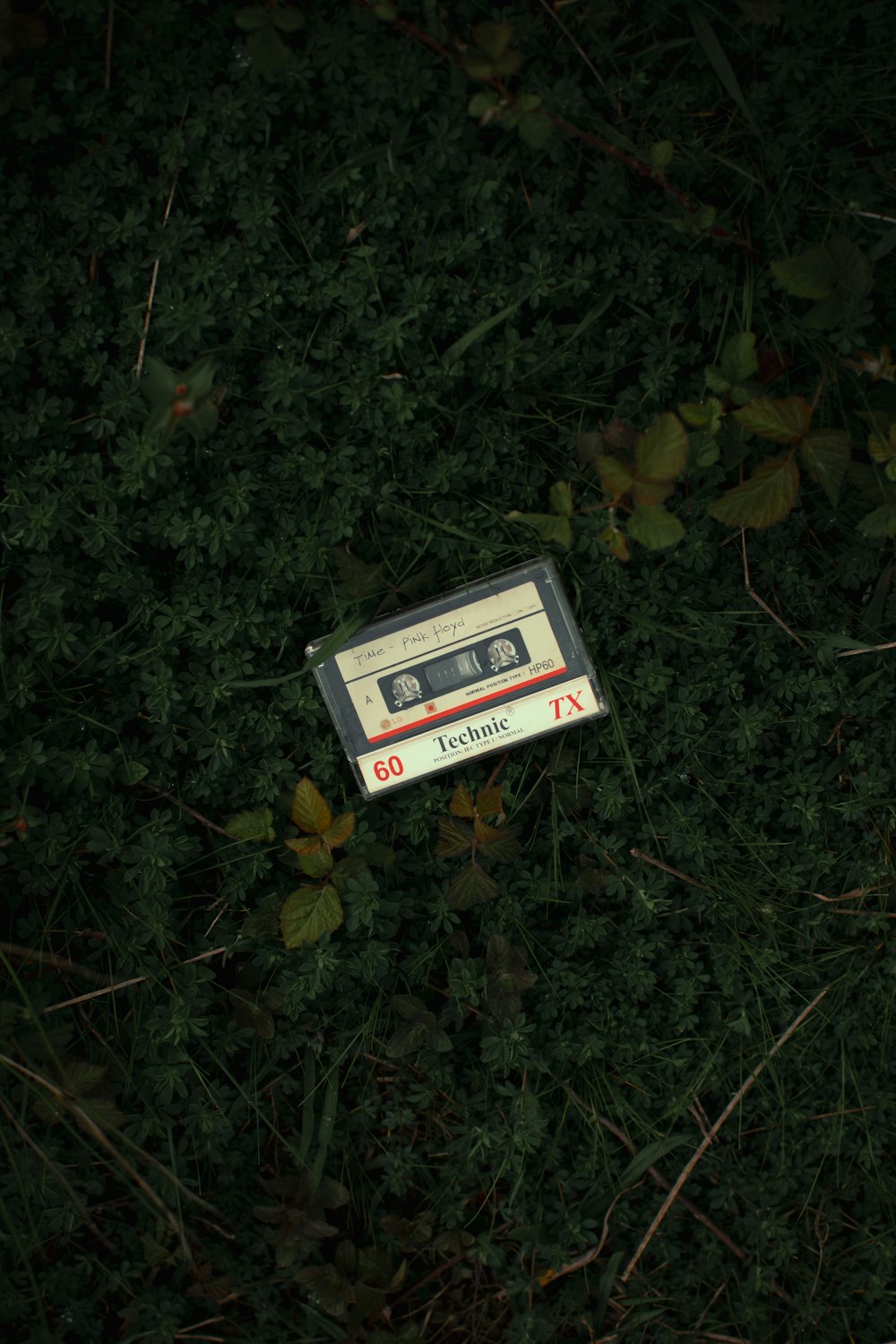 an old tape recorder laying on the ground