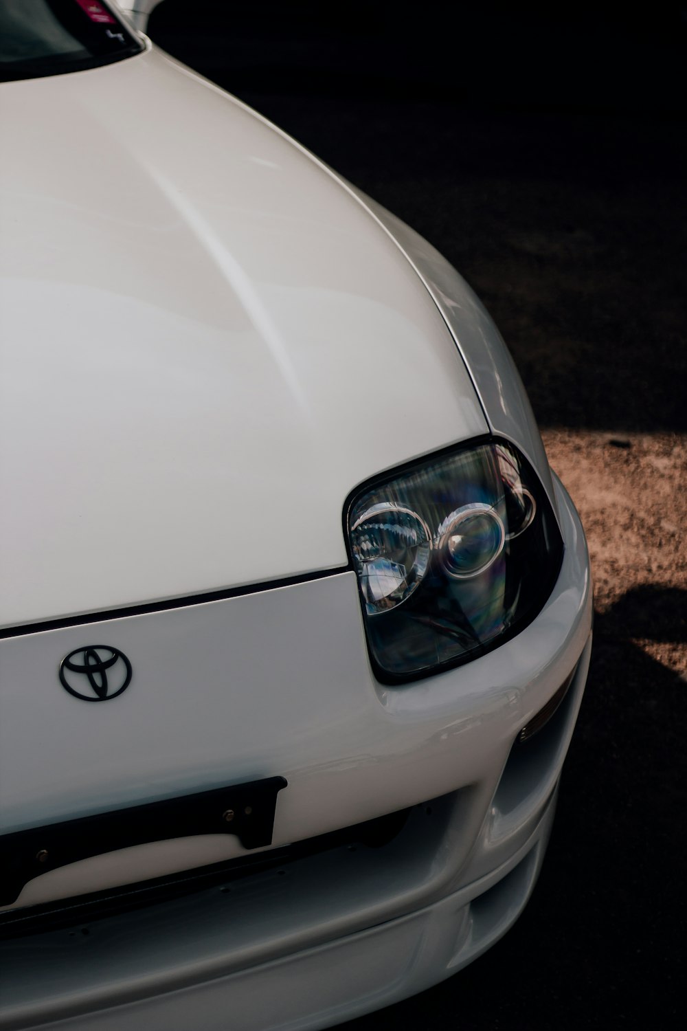 a close up of the front of a white car