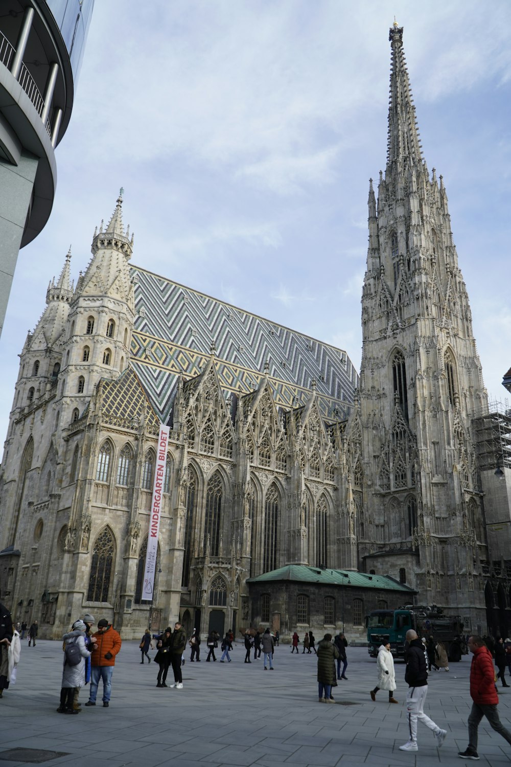 a group of people walking around a large cathedral