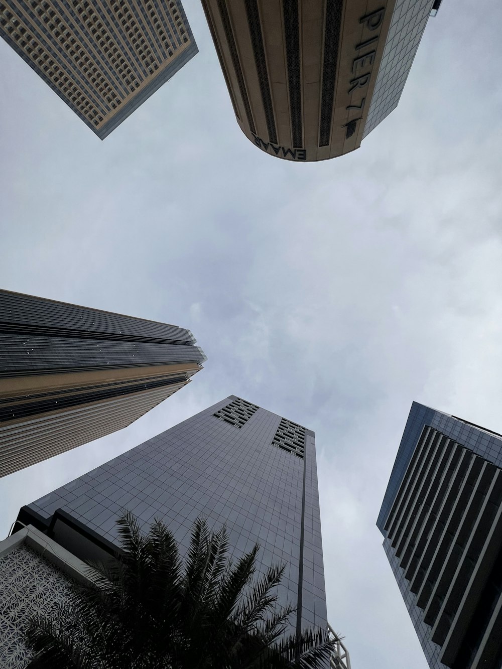 looking up at tall buildings in a city