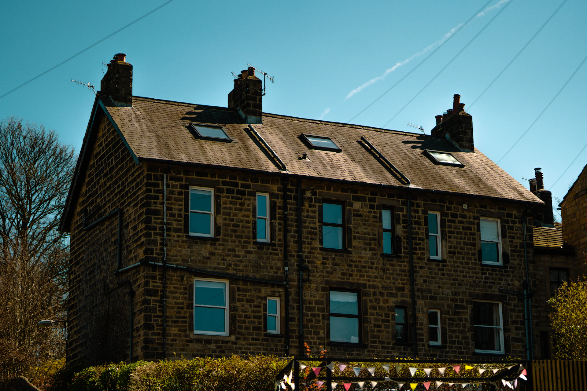 Large UK commercial brick building with an expansive roof