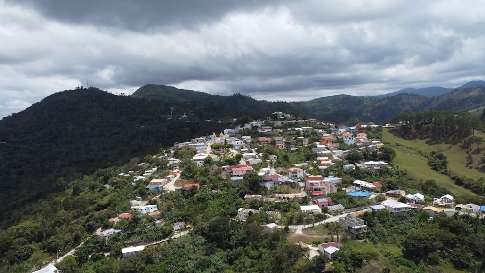 an aerial view of a village in the mountains