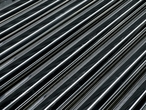 Close-up of a sleek black powder coated metal frame with a smooth matte finish