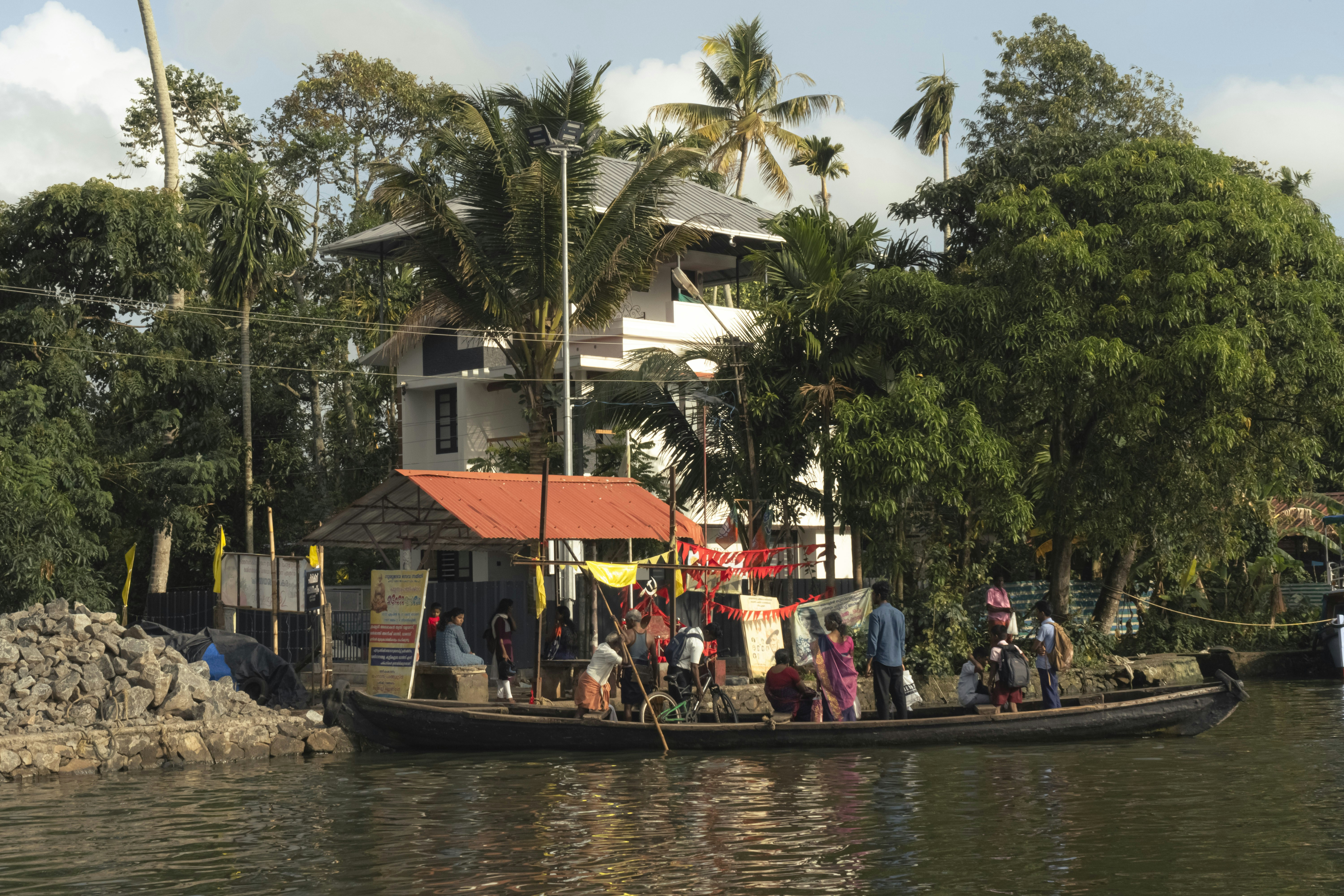 a group of people on a boat in a body of water, kerala Trip on water boat.....