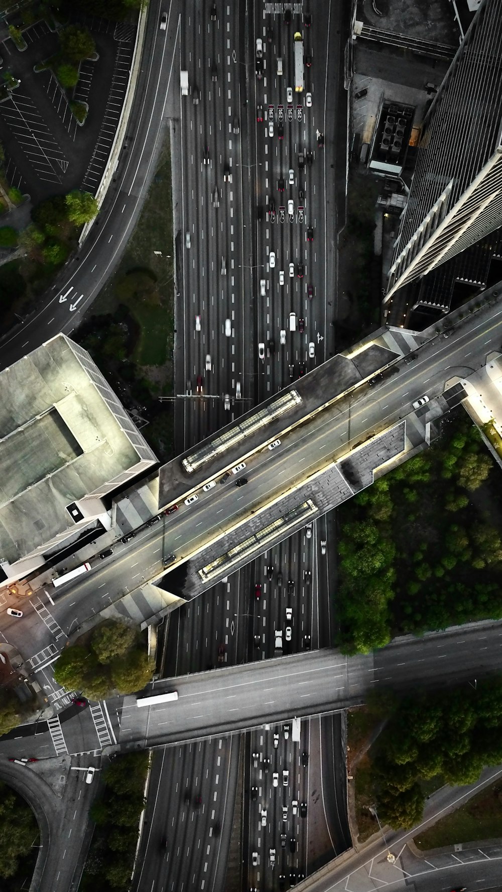 an aerial view of a highway intersection in a city