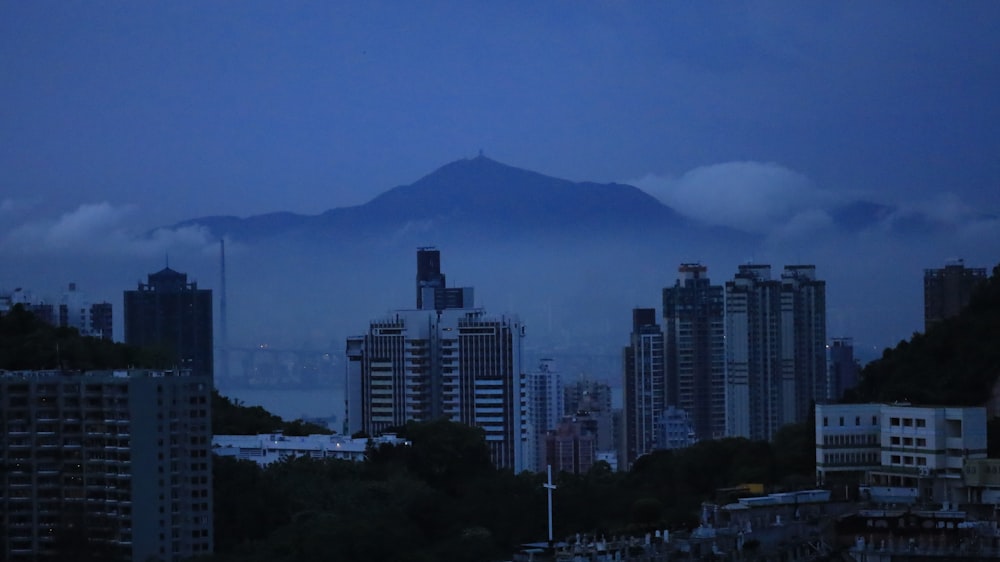 a view of a city with a mountain in the background