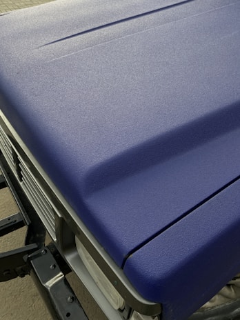 Before and after comparison of a car hood with and without the PPF film, emphasizing scratch resistance.