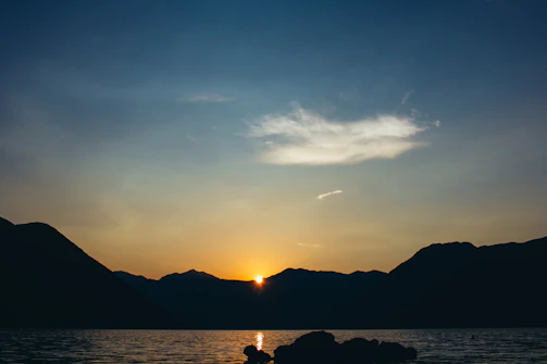 A serene sunset over Vancouver's mountains, symbolizing peaceful transitions.