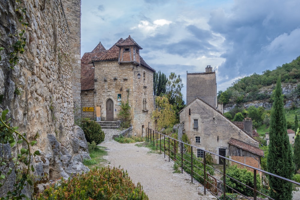 a stone building with a walkway leading to it