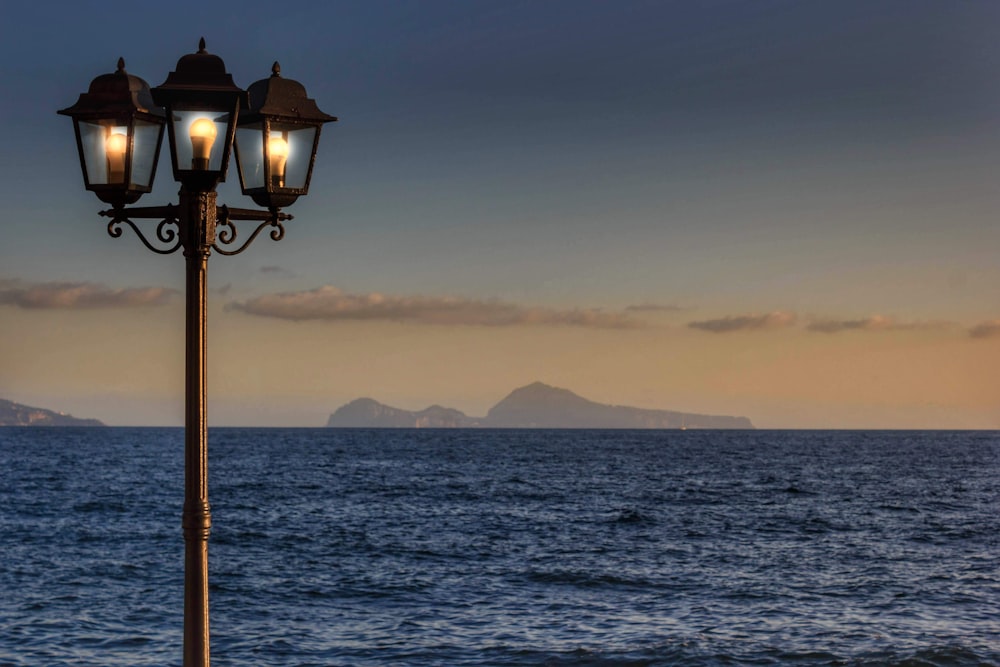 a lamp post with two lights on top of it