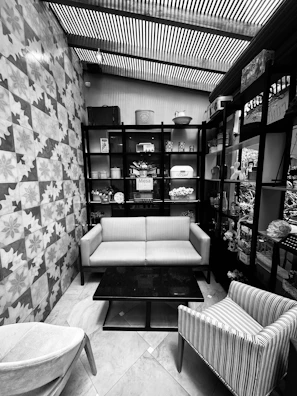 Cozy indoor seating area featuring minimalist black and white decor.