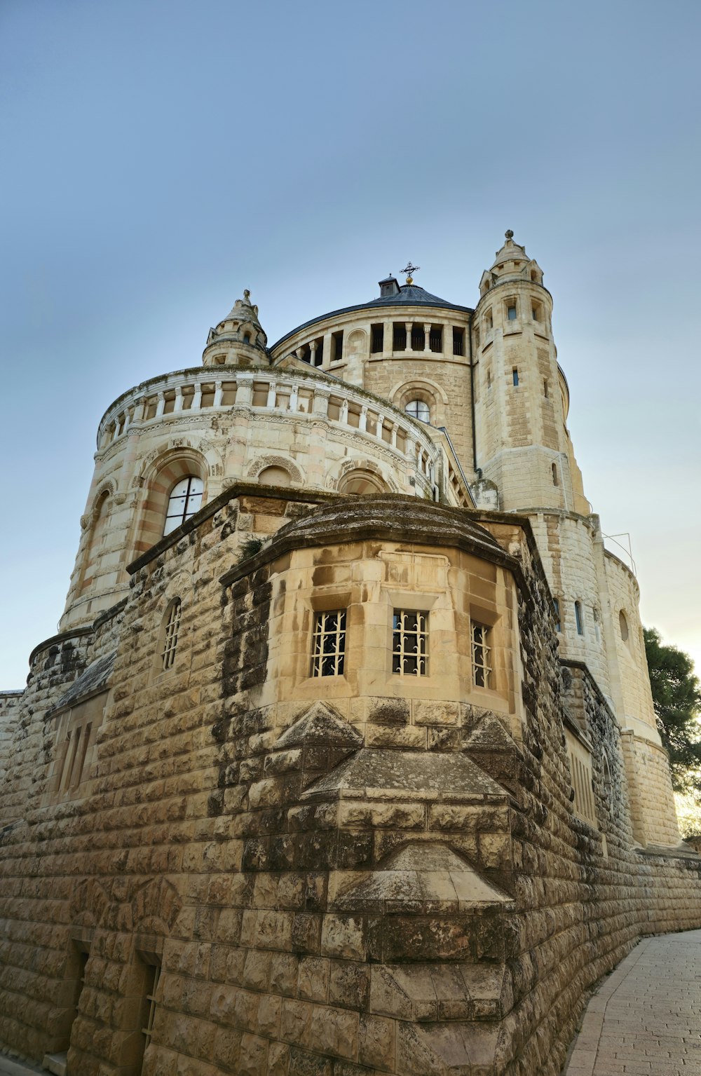 a large castle like building with a clock on it's side